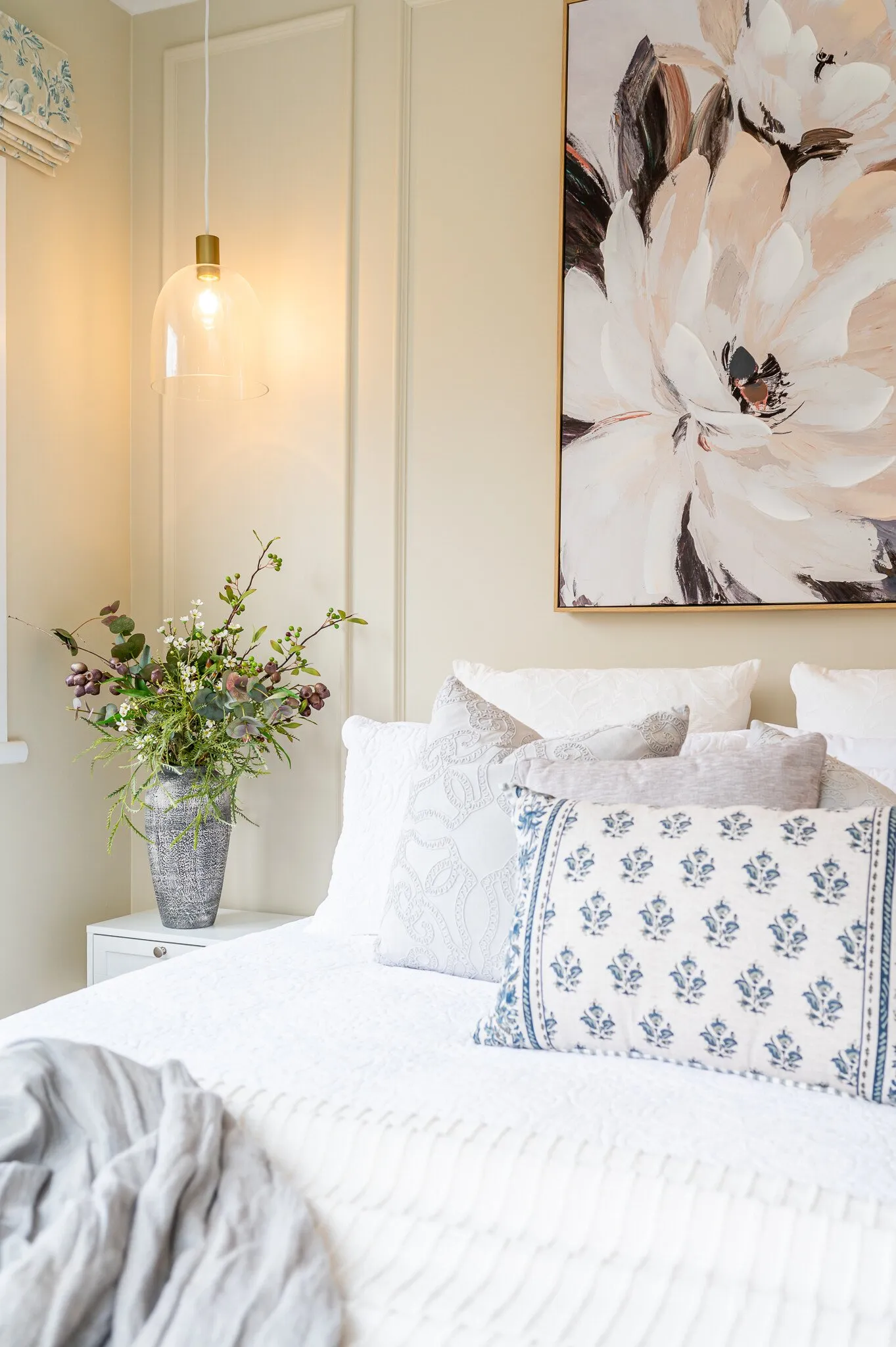 Image of newly renovated guest double bedroom in sand. Double bed styled with greys & white decorative pillows. Renovated by local Te Awamutu residential builders, Whitechurch Construction.