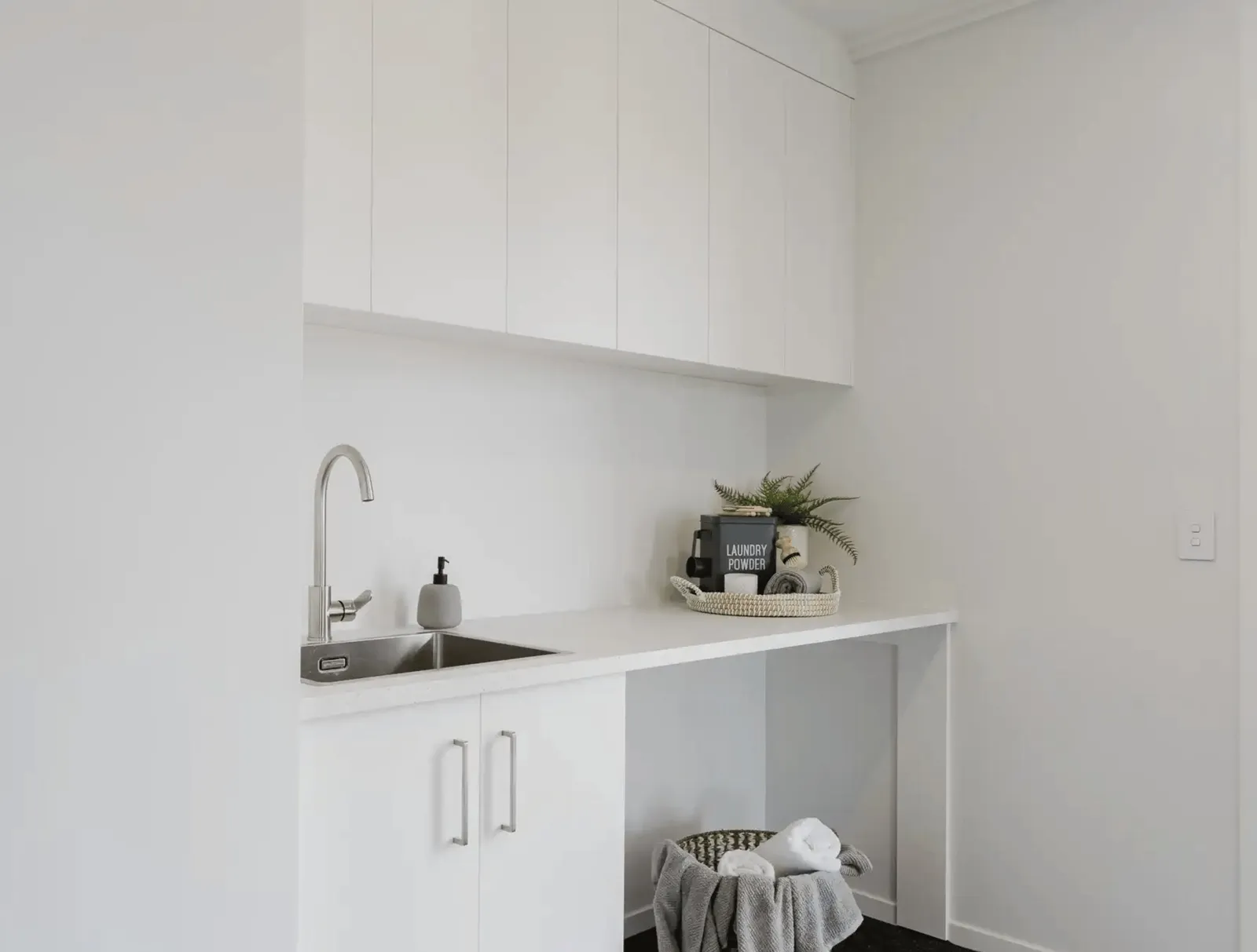 Image of modern white laundry room in Collinson Street, Pirongia new home, by Waikato residential builders Whitechurch Construction Limited.