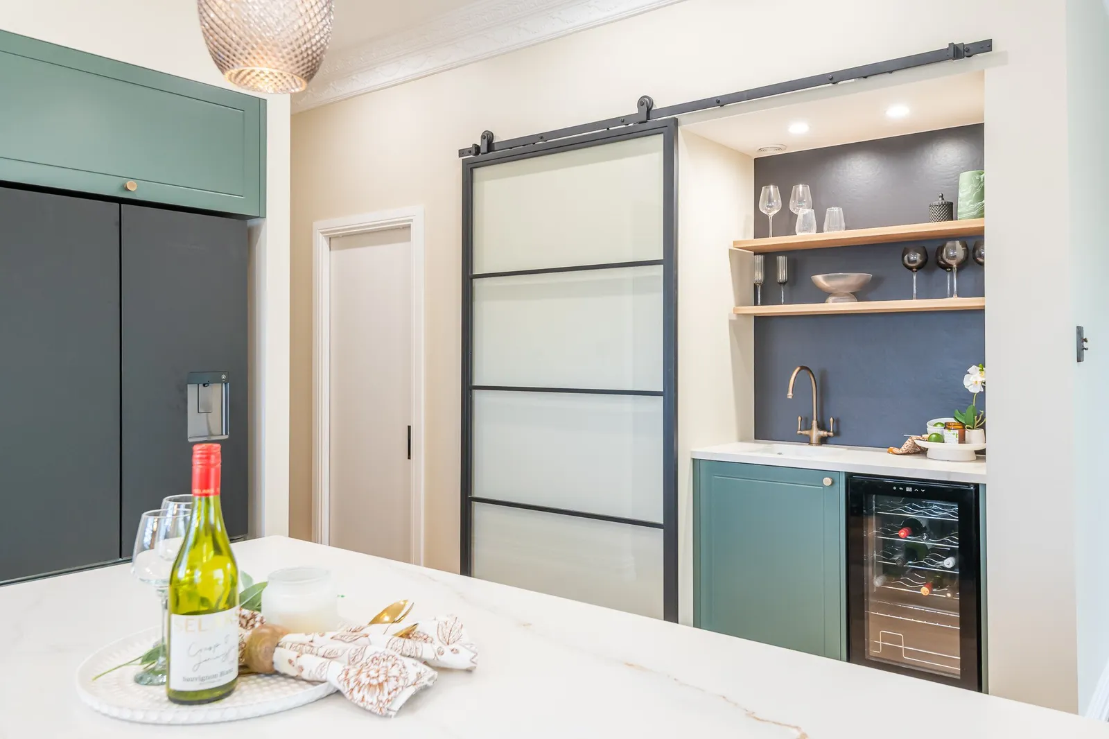 Image of newly renovated heritage kitchen in deep sage & white. Renovated by local Te Awamutu residential builders, Whitechurch Construction.