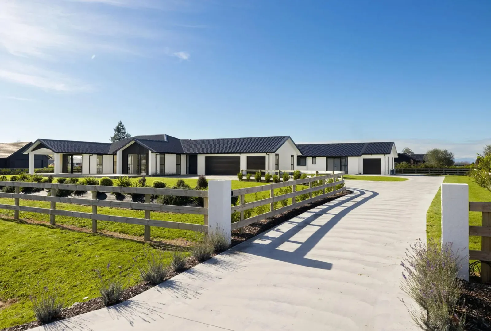 Full site image of modern new home with alfresco areas at Collinson Street, Pirongia, by Waikato residential builders Whitechurch Construction Limited.