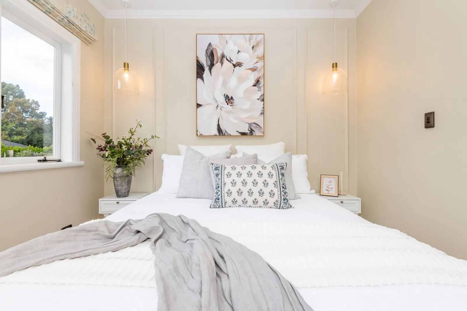 Image of newly renovated guest double bedroom in sand. Double bed styled in greys & white. Renovated by local Te Awamutu residential builders, Whitechurch Construction.