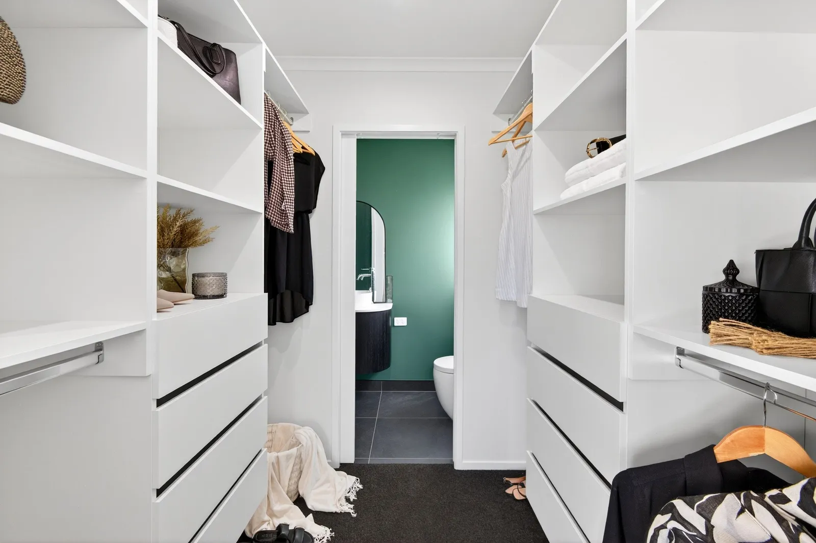 Walk in wardrobe with white cabinetry in Gordonton Road new build by Whitechurch Construction, Te Awamutu builders.
