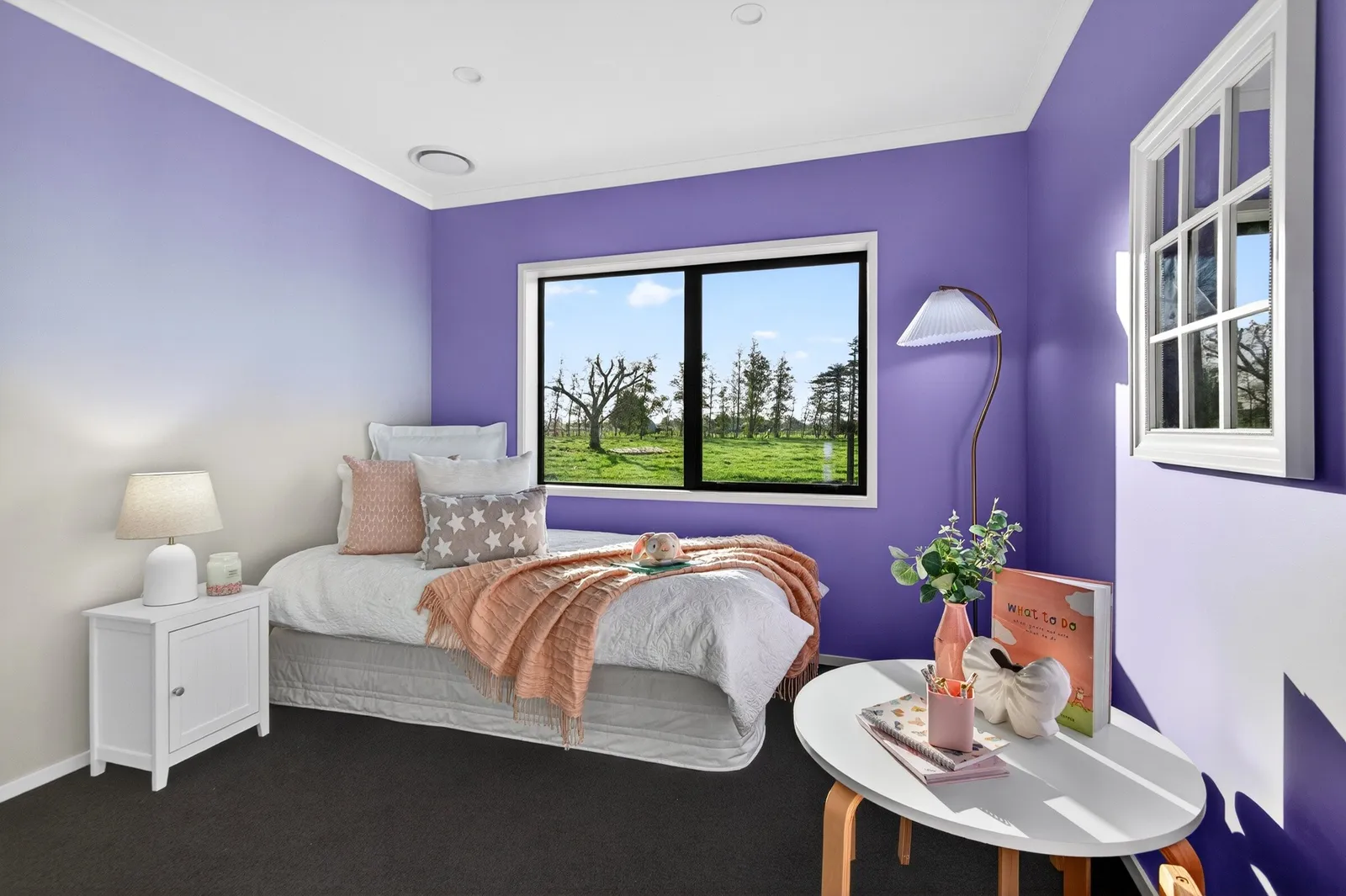 Purple painted feature wall girls bedroom in Gordonton Road new build by Whitechurch Construction, Te Awamutu builders.