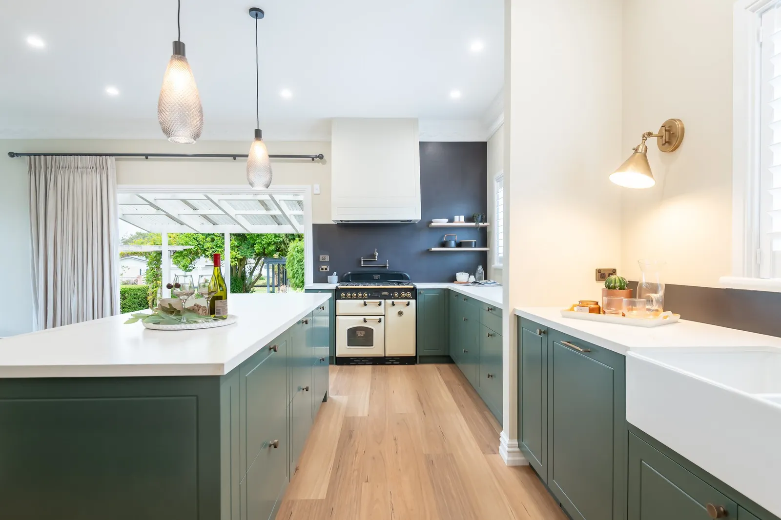 Image of newly renovated heritage kitchen in deep sage & white. Renovated by local Te Awamutu residential builders, Whitechurch Construction.