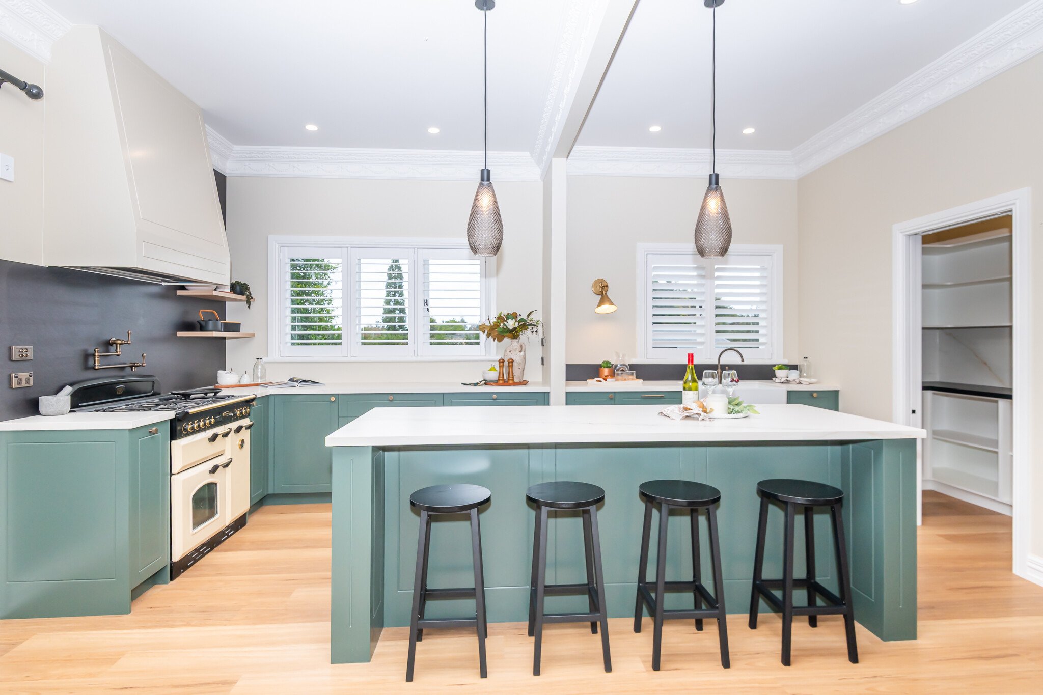 Heritage kitchen in deep sage and white at Franklin Street, renovated by Whitechurch Construction.
