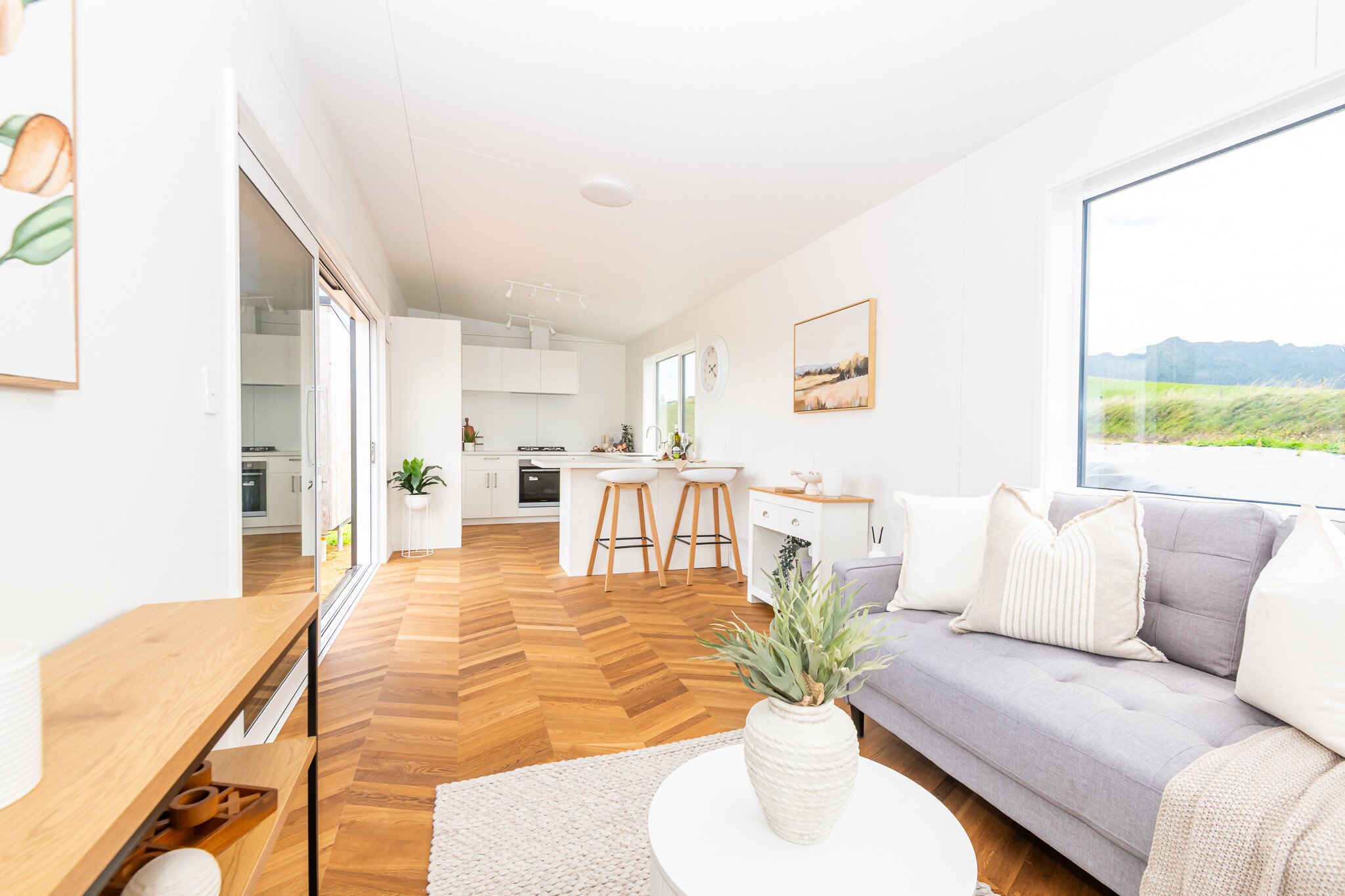 Wide angle view of the living room and kitchen