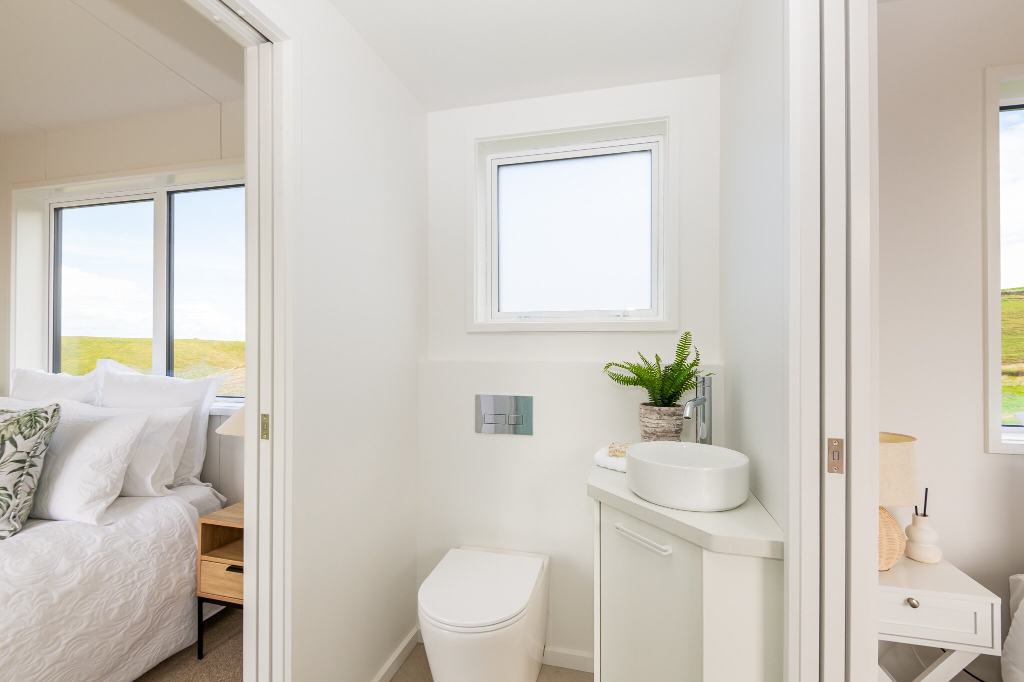 toilet and vanity inside the tiny home cabin
